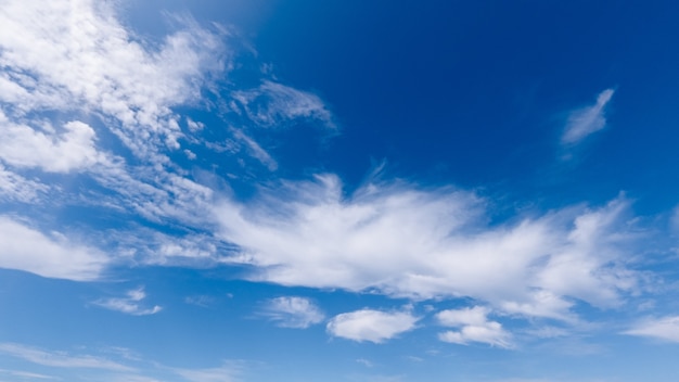 Image of white cumulus clouds on a blue sky, bright sunny day, beautiful natural landscape