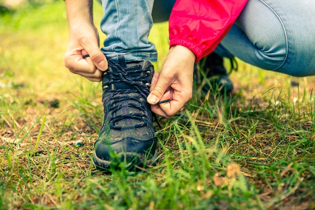 Image of woman tying shoelaces