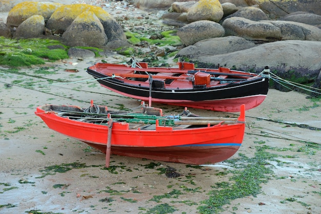 Image of wooden fishing boat dries ashore