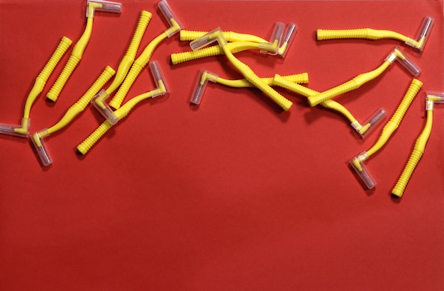 Image of yellow indental brushes on a red background at the top of the frame