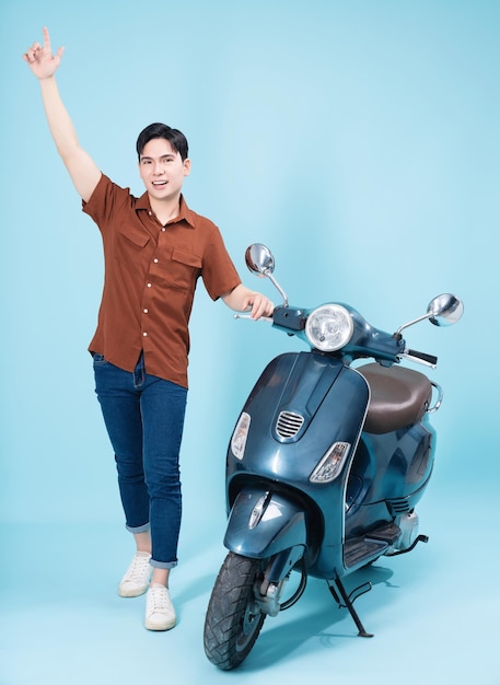 Image of yougn Asian man on motorbike