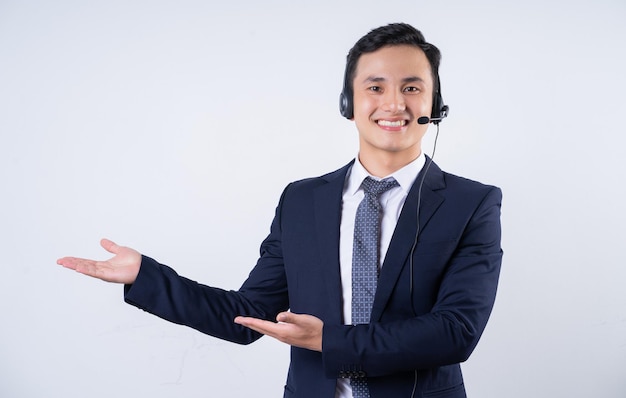 Image of young Asian businessman on background