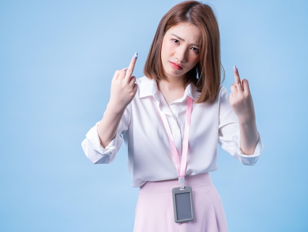 Image of young Asian businesswoman on blue background