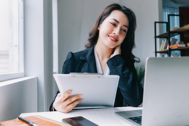 Image of young Asian businesswoman working at office