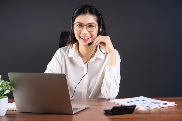 Image of young Asian businesswoman working at office