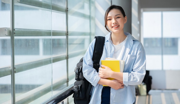 Photo image of young asian college girl at school