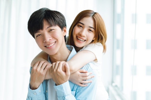 Image of young asian couple emotionally happy