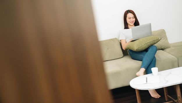 Image of young Asian woman at home