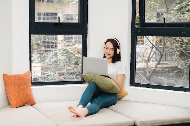 Image of young Asian woman at home