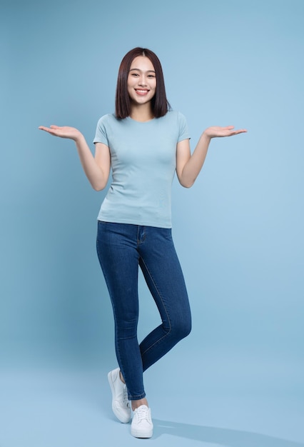 Image of young Asian woman posing on background