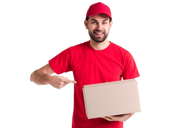 Image of a young delivery man pointing at the box