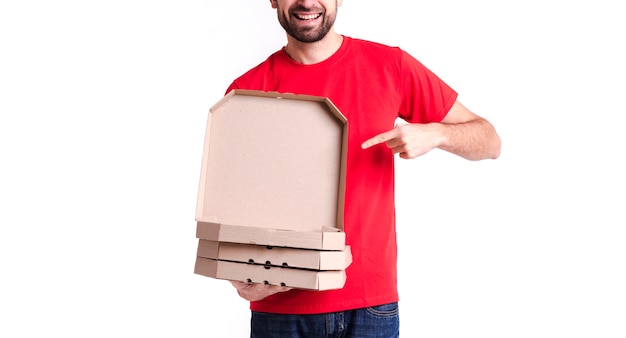 Image of a young delivery man showing pizza boxes