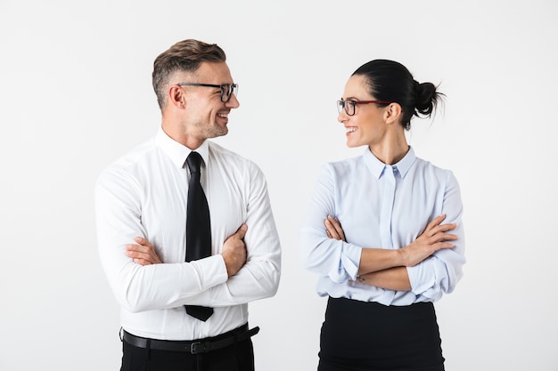 Image of young happy business colleagues couple isolated over white wall.