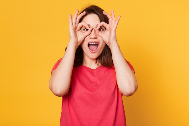 Image of young happy woman in red t shirt