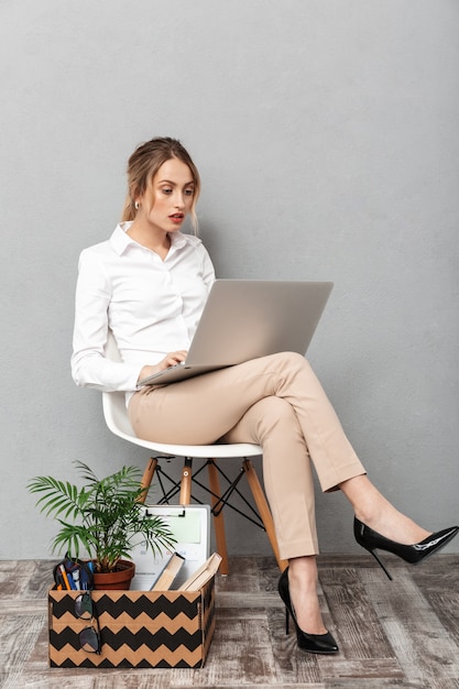 Image of a young shocked business woman isolated 