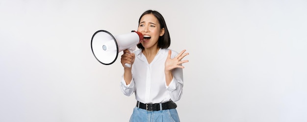 Image of young woman korean activist recruiter screaming in megaphone searching shouting at loudspea