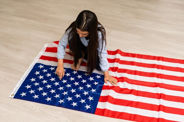 images of lovely little girl over USA flag background.