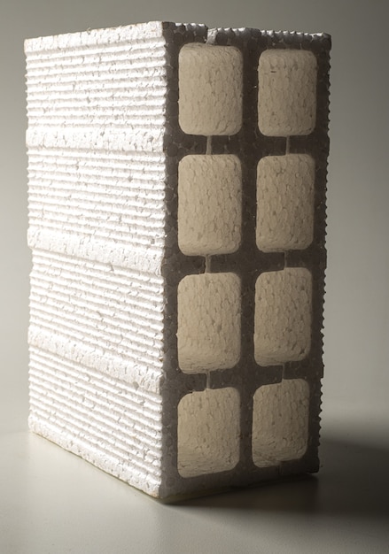 Imitation brick made of styrofoam for scenographic use on an infinite white background.