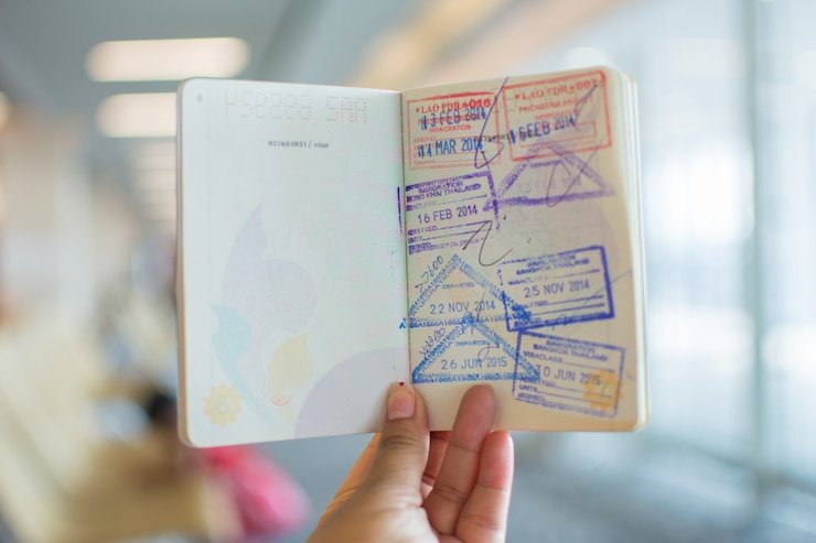 Photo immigration stamps on passport at airport. 