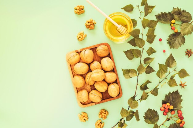 Immune boosting food Walnuts in shell and peeled honey and hawthorn branches