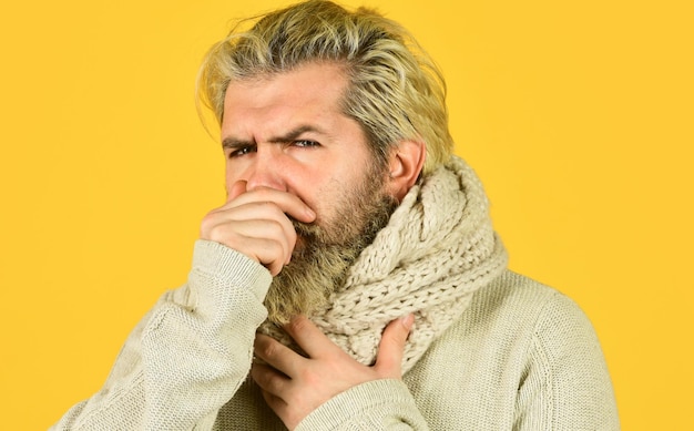 Immune response More than just symptom of illness Hipster fever Cold flu fever concept Body temperature Fever and thermal regulation of immunity Bearded man sick Warm scarf around neck