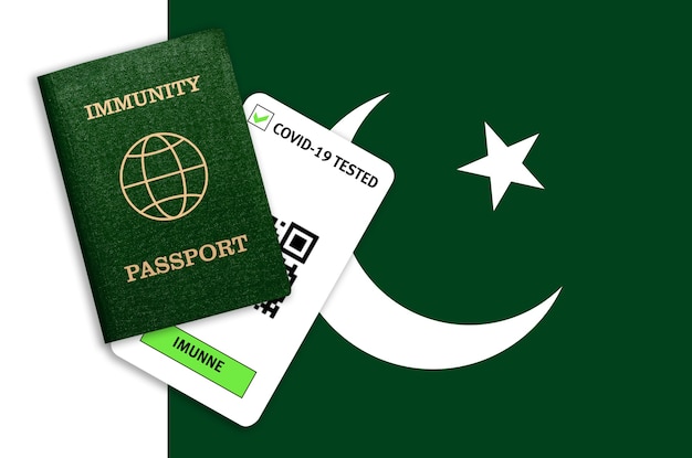 Immunity passport and test result for COVID-19 on flag of Pakistan. Certificate for people who have had coronavirus or made vaccine.