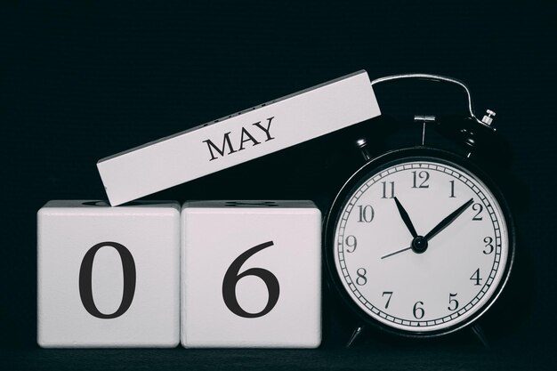 Important date and event on a black and white calendar Cube date and month day 6 May Spring season