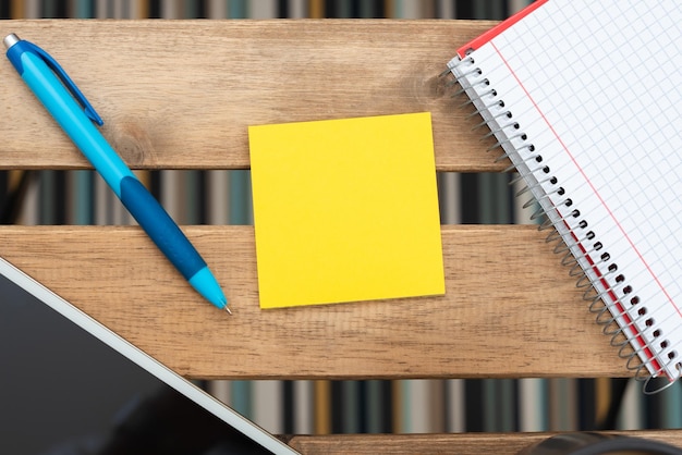 Important Message On Sticky Note With Pen Phone Screen And Notebook Around Placed On Table Crutial Information On Piece Of Paper With Tablet And Ball Point