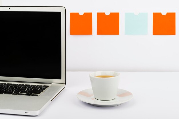 Important Messages On Lap Top On Desk With Notes And Cup Of Tea Crutial Informations On Computer Screen On Table With Hot Drink Critical Announcements Presented