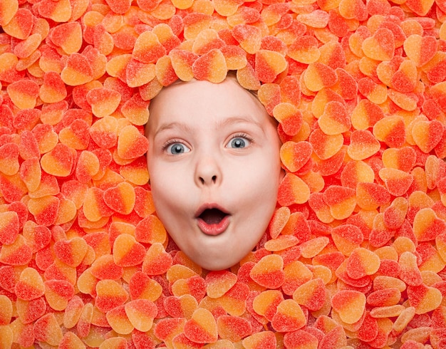 Impressed child posing in fruit jelly