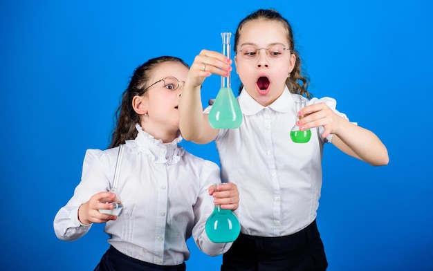 Improving modern medicine little smart girls with testing flask back to school children at chemistry lab biology education school kid scientist study science modern laboratory modern education