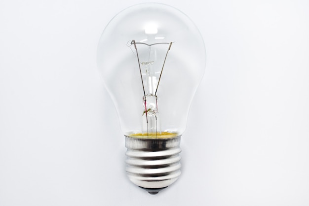 Incandescent bulb lies on a white background