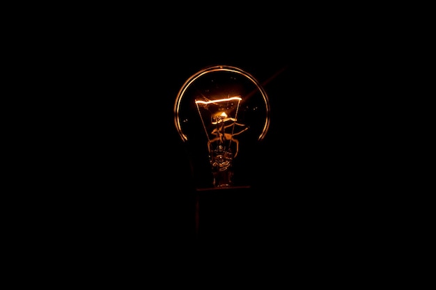 Photo incandescent lamp on a black background