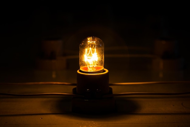 Incandescent lamps are connected by wires and glow in the dark