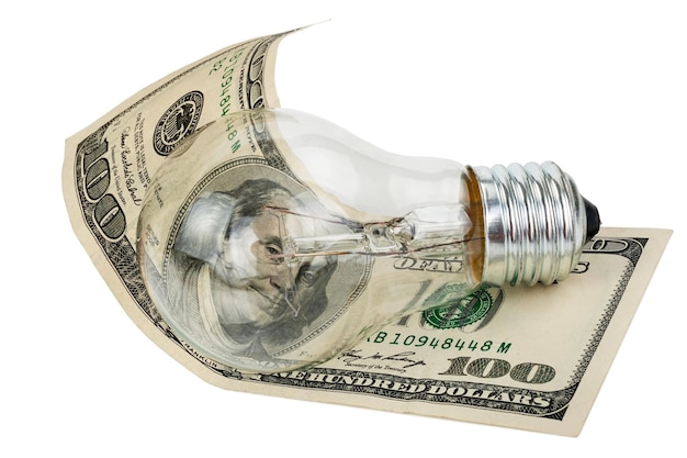 Photo incandescent light bulb and money