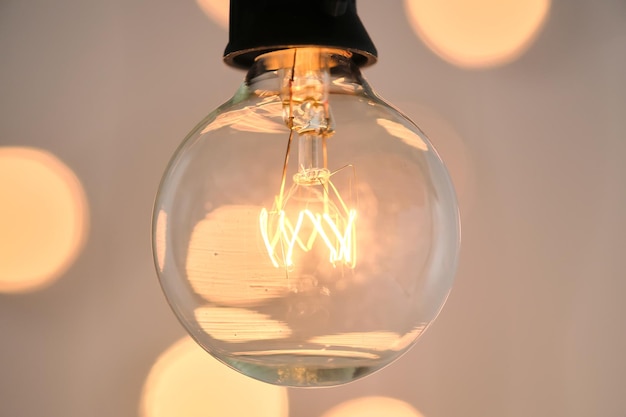 Incandescent light bulb with christmas round bokeh