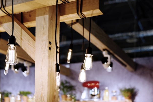 Photo incandescent light bulbs in a loft style room