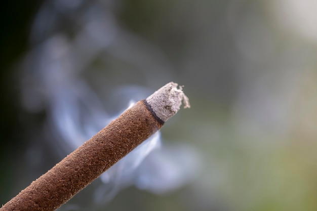 Incense stick burning with smoke closeup Island Bali Ubud Indonesia