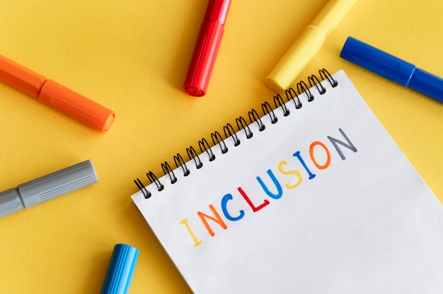 Inclusion word written in a notebook