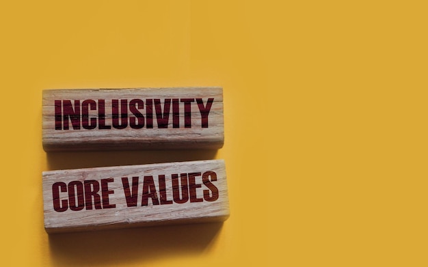 Inclusivity and core values words written on wooden blocks social and business concept