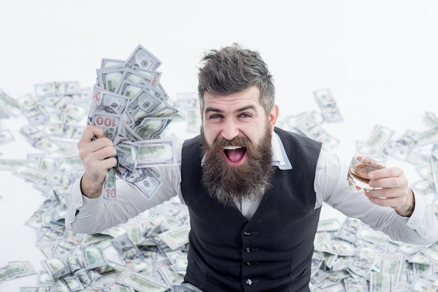 Income. Benefit. Earnings. People concept. Portrait of glad satisfied rich bearded millionaire demonstrating money. Easy-money. Bearded man excited with money.