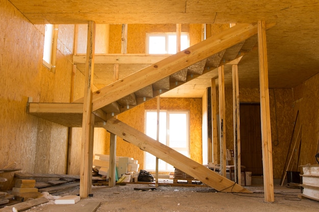 Incomplete Architectural Wooden Interior Design with Stairs, Illuminated with Sunlight