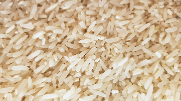 Photo incomplete grain white rice background