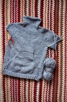 incomplete knitting gray sweater for child with needles