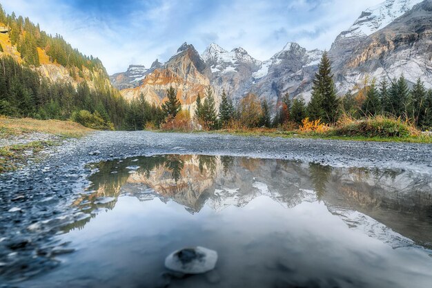 Incredible autumn view of Oeschinen valley and Bluemlisalp summit