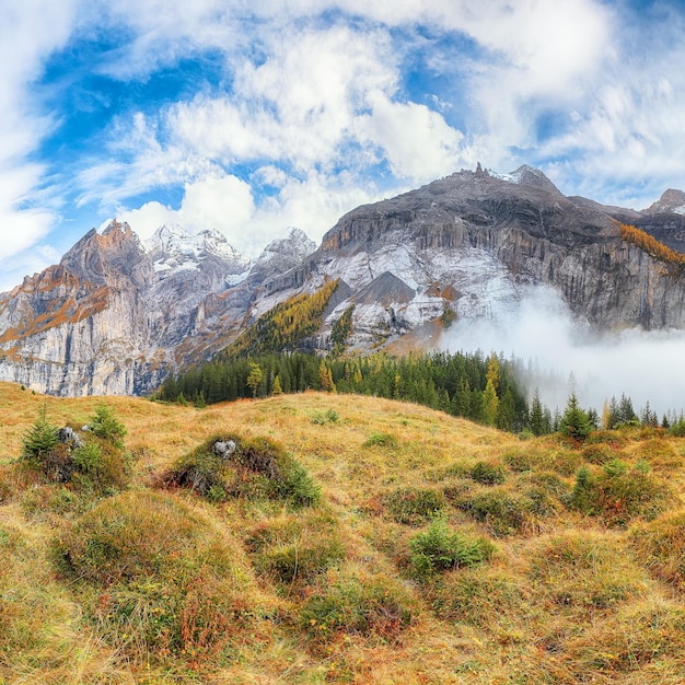 Incredible autumn view of Oeschinen valley and luemlisalp summit