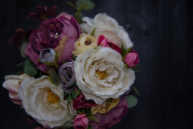 Incredible bouquet of pink and wite roses in vase on the black background