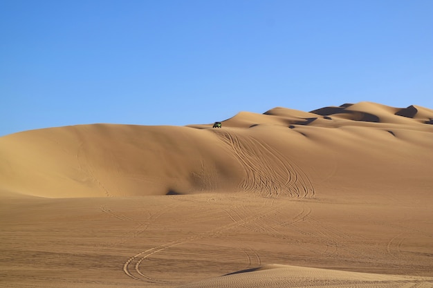 Incredible Sand Dunes with Sand Ripples and the Wheel Prints of Dune Buggies, Huacachina Desert, Peru