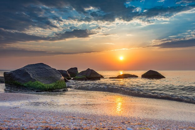 Incredible Sunrise on the rocky beach