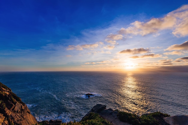 An incredible sunset in the cloud that is visible from a high hill on the beach